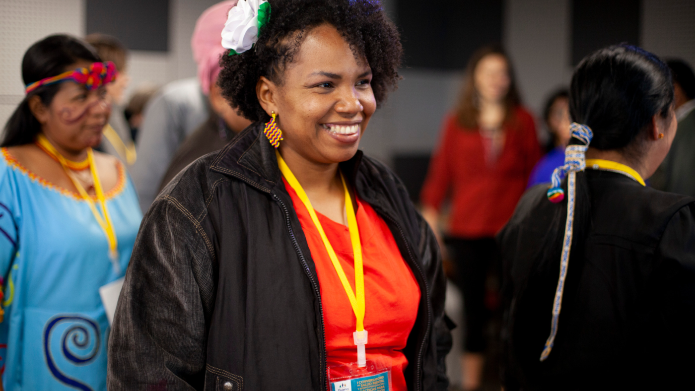 Colombian woman smiling and discussing the afro-colombian community