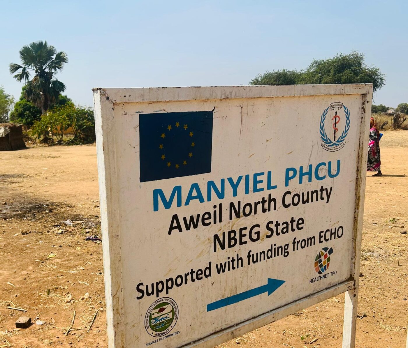 A road sign showing Manyiel PHCU Aweil North, South Sudan