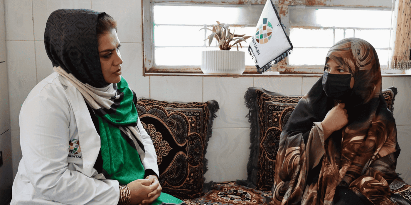 A female health psychosocial counsellor with a female patient in Afghanistan
