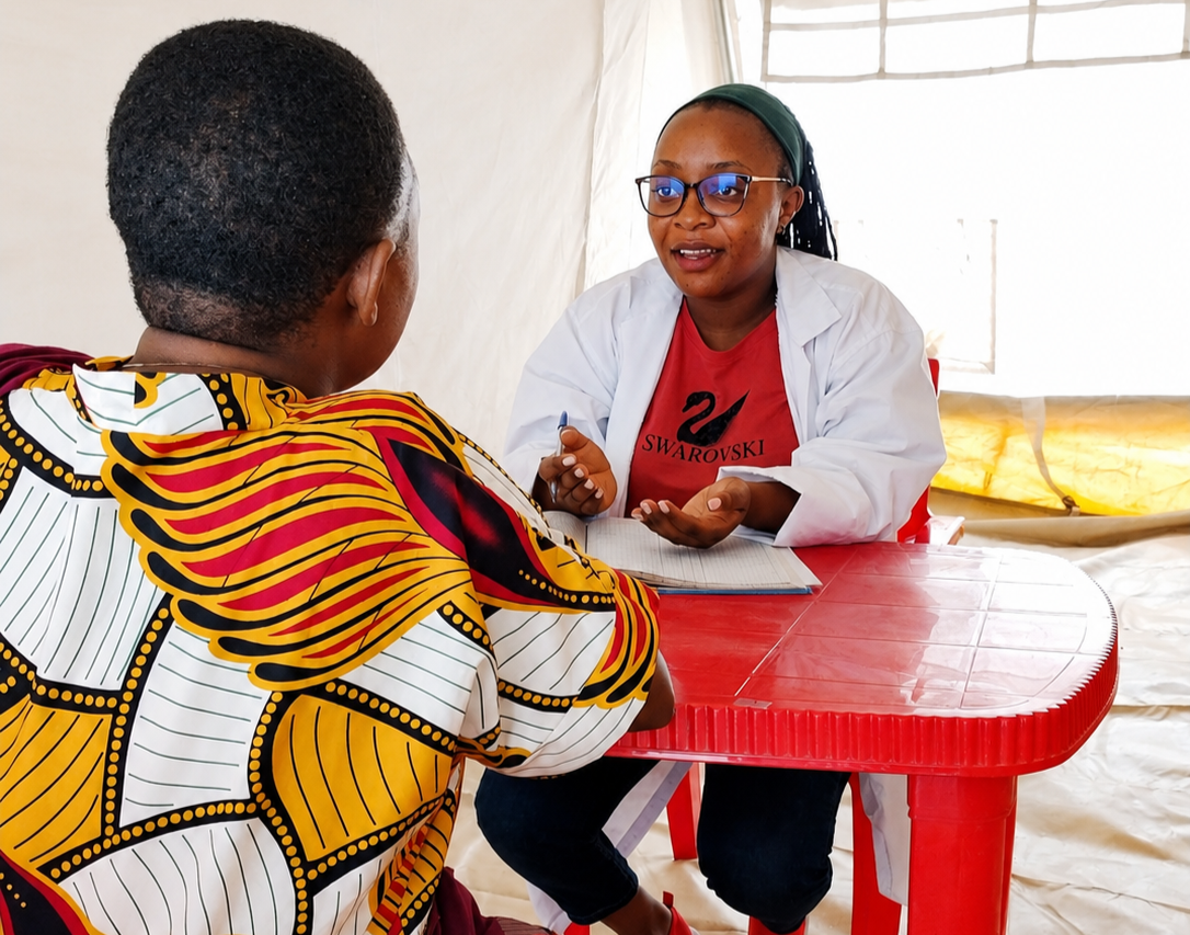 Mental health worker and woman during consultation at refugee camp