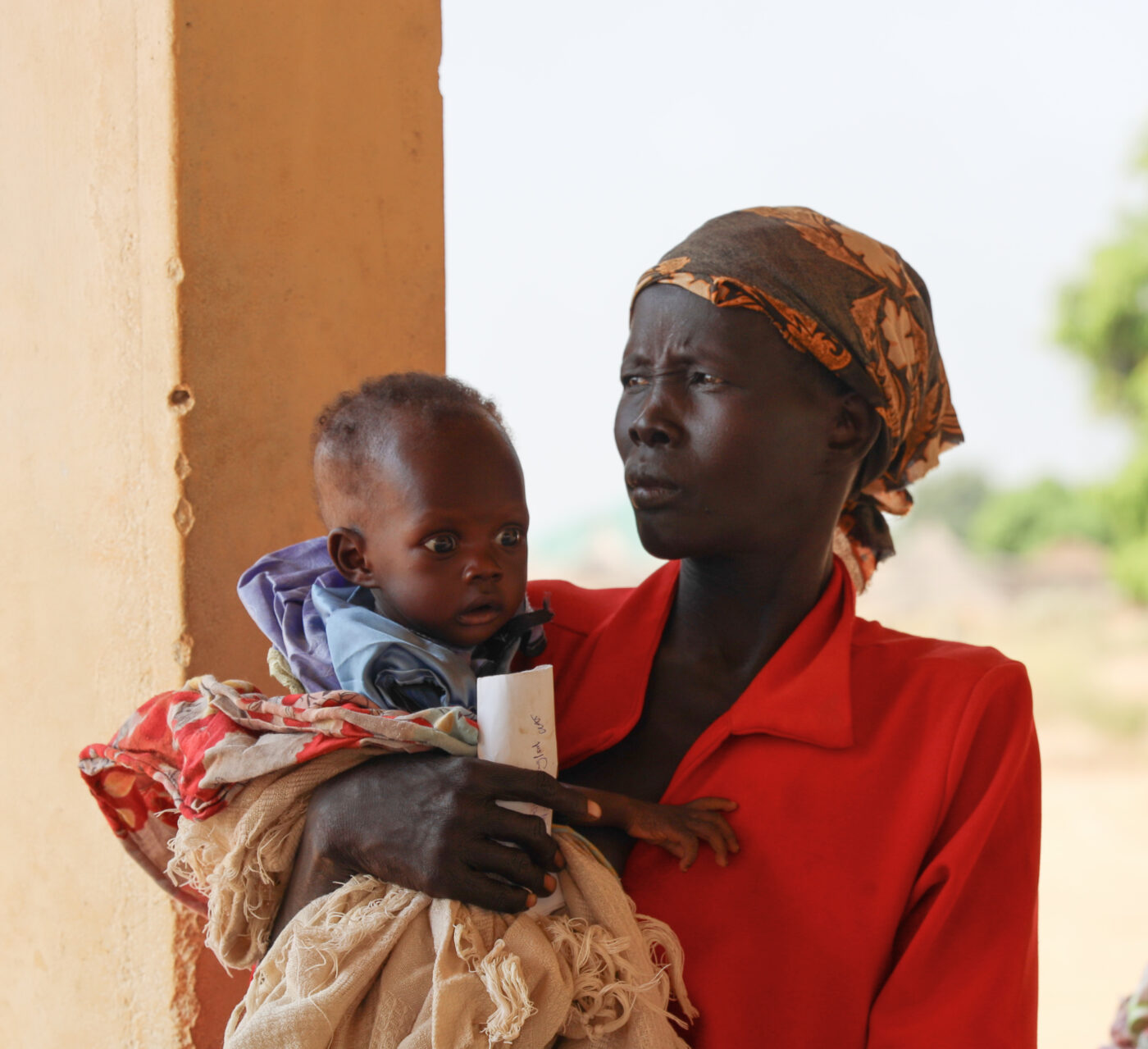 South Sudanese woman holding a baby