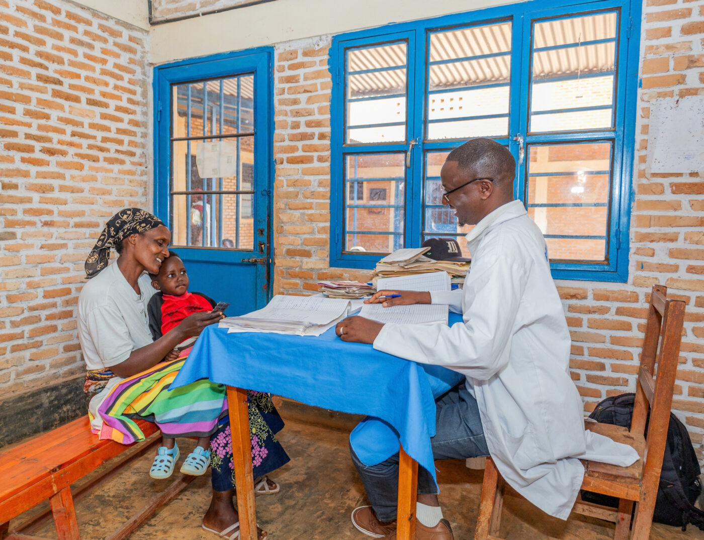 Doctor attending a mother and child at Refugee Camp in Burundi